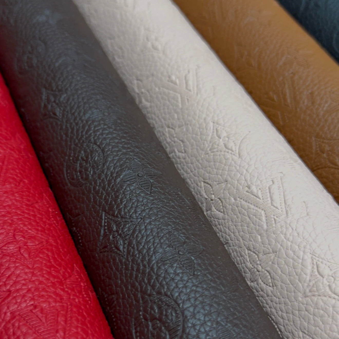 INWARD EMBOSSED LOGO LEATHER